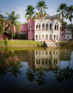 Pink temple in front of a small lake