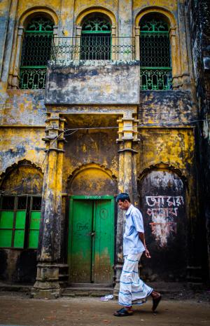 Man walking in a colorful street