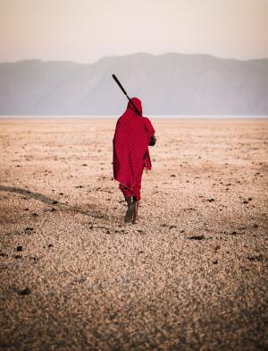 Massai walking in a dry lake
