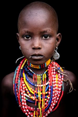 Portrait of an Arbore girl with colorful necklaces