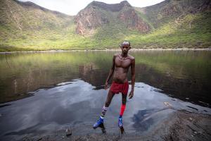 Salt digger in front of the dark salt lake